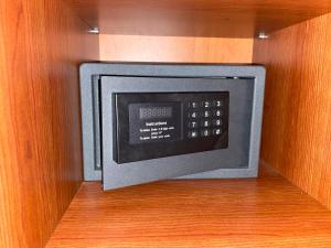 a microwave oven in a cabinet in a kitchen at Gold Apartments in Budapest