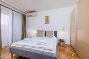 Posteľ alebo postele v izbe v ubytovaní Venus Apartments - Synagogue I