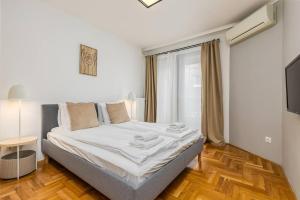 Posteľ alebo postele v izbe v ubytovaní Venus Apartments - Synagogue I