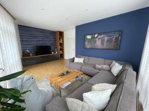 a living room with a couch and a coffee table at Ferienwohnung Bad Reichenhall Center in Bad Reichenhall