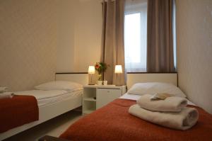 Posteľ alebo postele v izbe v ubytovaní Cracow Central Aparthotel