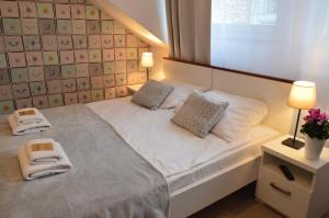 Posteľ alebo postele v izbe v ubytovaní Cracow Central Aparthotel