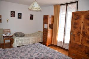 a bedroom with two beds and a dresser at Appartamento La Fenice Rango in Balbido-rango