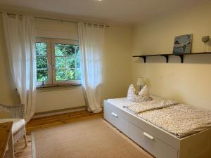Postel nebo postele na pokoji v ubytování Ferienwohnung im Landhaus