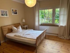 Postel nebo postele na pokoji v ubytování Ferienwohnung im Landhaus