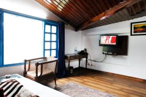 TV a/nebo společenská místnost v ubytování Manu Maharani Regency