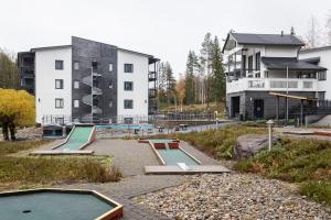 a skate park with several ramps in front of a building at Vuokatti Booking Suites in Vuokatti