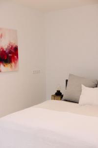 Ένα ή περισσότερα κρεβάτια σε δωμάτιο στο 130m² Apartment im Zentrum + Terrasse