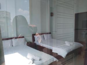 Giường trong phòng chung tại Khách sạn Thanh Vân