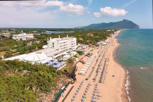 an aerial view of a beach with umbrellas and the ocean at Hotel Oasi Di Kufra in Sabaudia