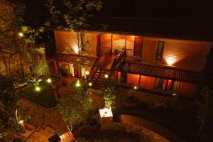 an overhead view of a building at night with lights at Sereno Barn Eco Stay Chikmagalur in Chikmagalūr