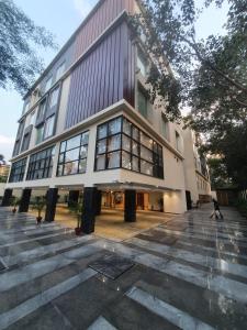 a large building with a lot of windows at Best Western Maharani Bagh New Delhi in New Delhi