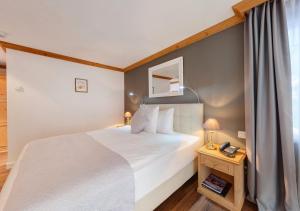 Letto o letti in una camera di Hotel Albatros