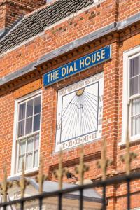 a sign on the side of a brick building at The Dial House in Reepham