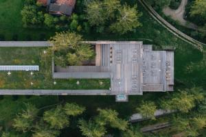 an overhead view of a building in a park at Vigilius Mountain Resort in Lana