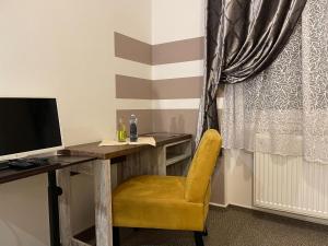 TV a/nebo společenská místnost v ubytování Hotel Herman