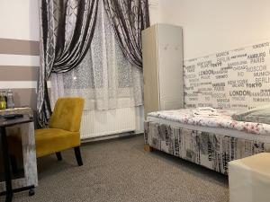 Postel nebo postele na pokoji v ubytování Hotel Herman