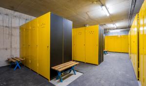 a row of yellow lockers in a locker room at Roshka 2 BD Apart 501 in Gudauri