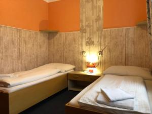 Postel nebo postele na pokoji v ubytování Hotel Herman