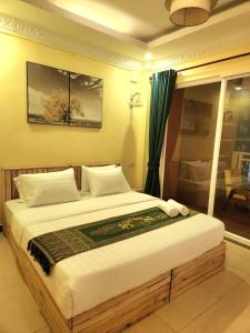 Llit o llits en una habitació de SOMA HOTEL