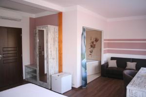 Postel nebo postele na pokoji v ubytování Hotel Herman