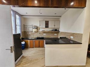 A kitchen or kitchenette at Ankhi's Villa with Parking