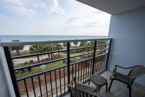 a balcony with a view of the ocean at Oceanfront Convenience on Lower Floor, Heated Pool in Myrtle Beach