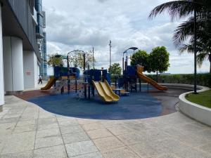 a playground in a building with a slide at GS home in Nusajaya