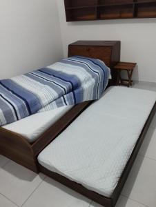 Ένα ή περισσότερα κρεβάτια σε δωμάτιο στο Recanto Vista Mar