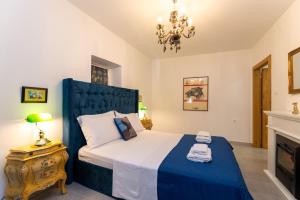 a bedroom with a bed and a chandelier at LA MARLENA in Benkovac +52 photos