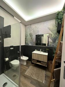 a bathroom with a shower and a toilet and a sink at Falco Luxury Home in Naples