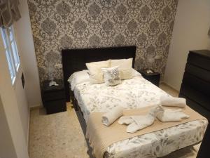 Posteľ alebo postele v izbe v ubytovaní CENTRO ANTEQUERA Apartamento Las Recoletas