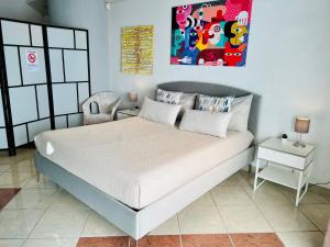 Postel nebo postele na pokoji v ubytování Amarin Pisa Room