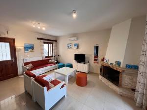 Телевизор и/или развлекательный центр в Villa Spilia Homeleader