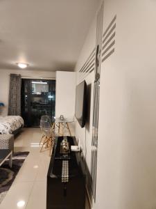 a living room with a black and white wall at Umhlanga flat near Gateway mall in Durban