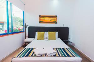 Letto o letti in una camera di Hotel Guatatur