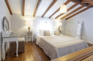 Postel nebo postele na pokoji v ubytování Glyfada Beach Villas