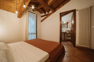 a bedroom with a large bed in a room at Maison Cornalin by Hili in Aosta