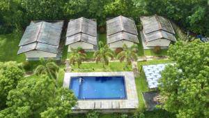 an aerial view of a house with a swimming pool at Jungle Paradise in Udawalawe