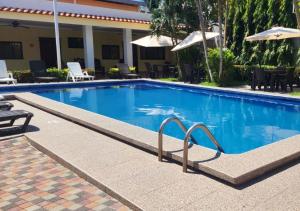 Swimmingpoolen hos eller tæt på Hotel y Restaurante Maria Ofelia