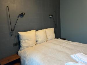 Łóżko lub łóżka w pokoju w obiekcie Bella Vita