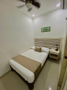 Postel nebo postele na pokoji v ubytování Hotel La Magdalena