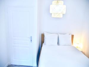 Postel nebo postele na pokoji v ubytování Travel Rio Logement en Colocation