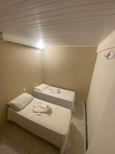 Postel nebo postele na pokoji v ubytování Morro de São Paulo Hospedagens