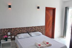Postel nebo postele na pokoji v ubytování Hotel Portobello