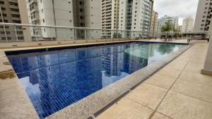 a swimming pool on the roof of a building at S4 Hotel - Studio particular - Apt 620 - Águas Claras in Brasilia