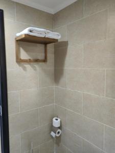 a shower stall with a roll of toilet paper in it at Cordoba suites Penthouse with private open air Jacuzzi in Hurghada