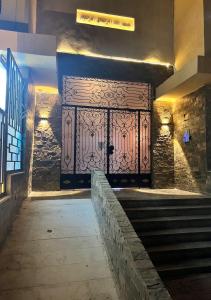 an entrance to a building with a large metal door at Comfort and Quit Apartment جاردينيا سيتي in Cairo
