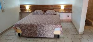 En eller flere senge i et værelse på Fête à la Guadeloupe (SI)