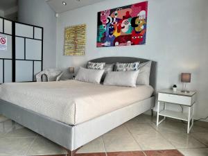 Postel nebo postele na pokoji v ubytování Amarin Pisa Room